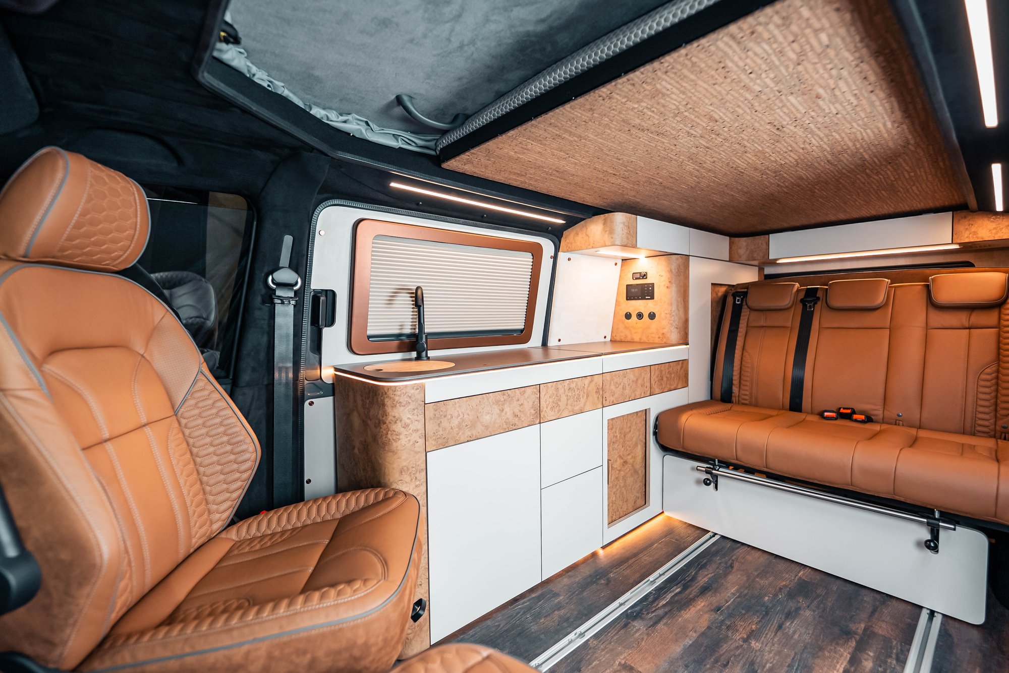 Shillingstone interior with tan leather seats and cork cabinetry