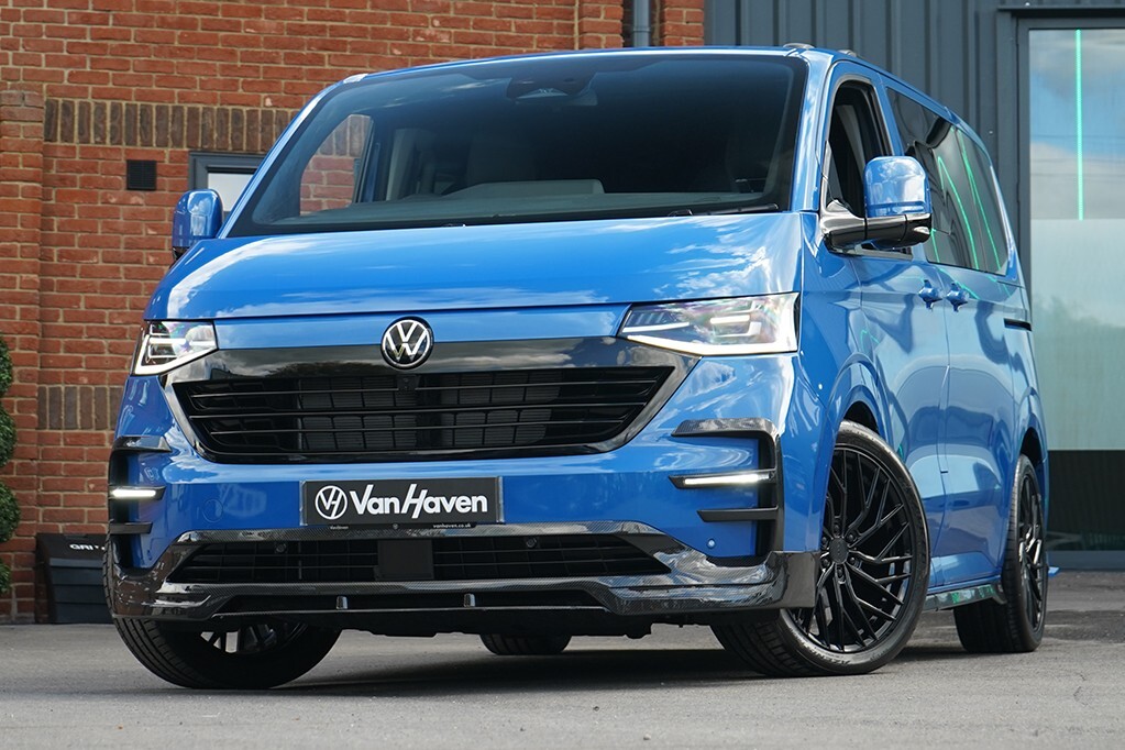 A VanHaven blue Transporter with carbon splitter outside the Dorset workshop