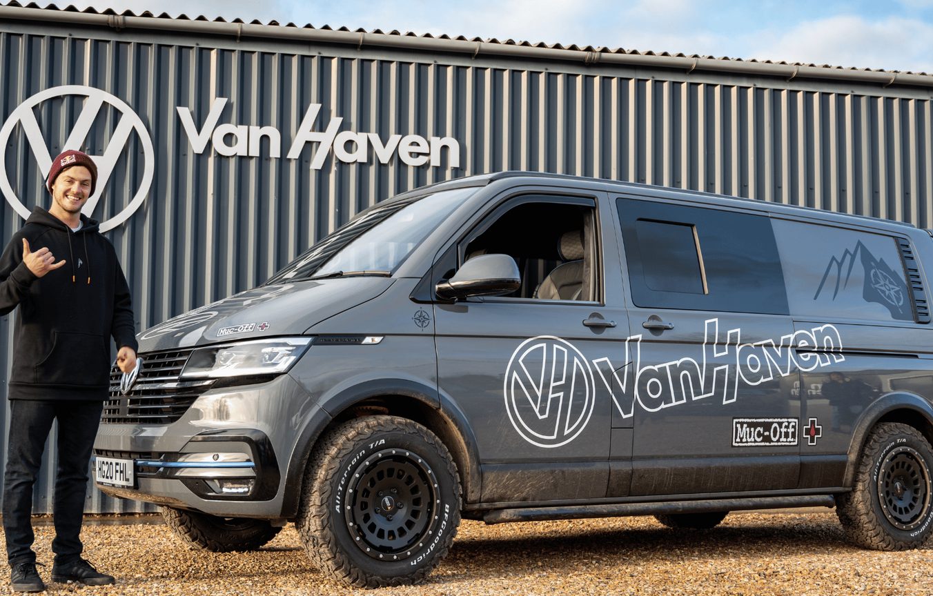 A VanHaven team member beside a finished conversion at the Dorset workshop