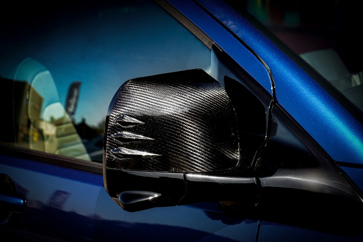 Carbon fibre mirror cap on a Van Haven T7