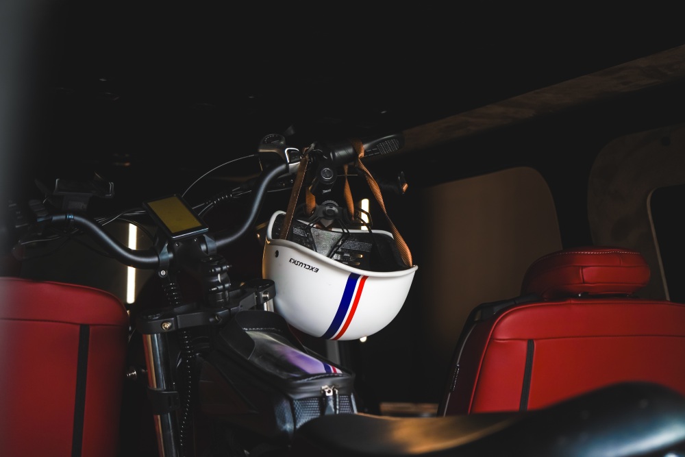 Van Haven T7 motorcycle secured between red leather seats